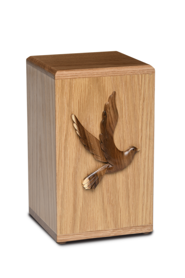 Wooden cremation urn with flying dove