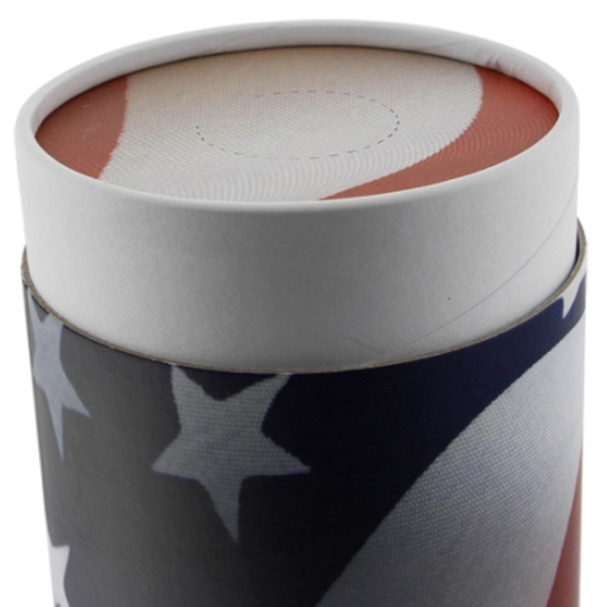 Close up view of American flag cylindrical cremation urn