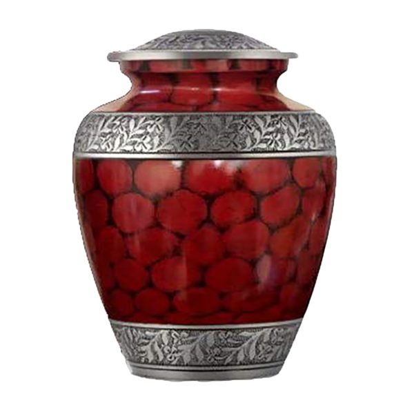 Small red cremation urn with silver accents